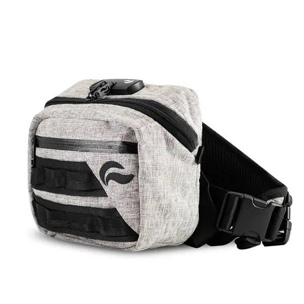 The Skunk Kross Stash Storage Bag is a light gray fabric waist bag with a black zipper, front straps, side-release buckle, small black logo, smell-proof carbon lining, airtight storage, and a combo lock for discreet odor elimination.
